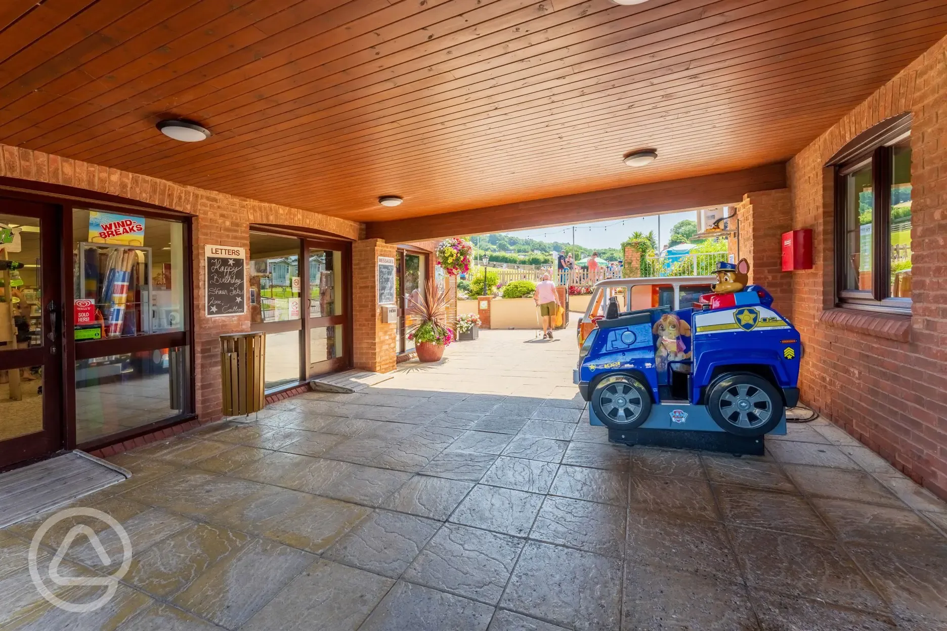 Outside of reception with coin-operated children rides