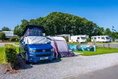 VW campervan and awning on electric hardstanding pitch (6m)
