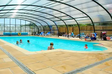 Kids playing in the indoor heated swimming pool at River Valley Holiday Park