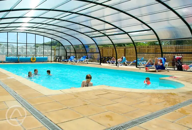 Kids playing in the indoor heated swimming pool at River Valley Holiday Park