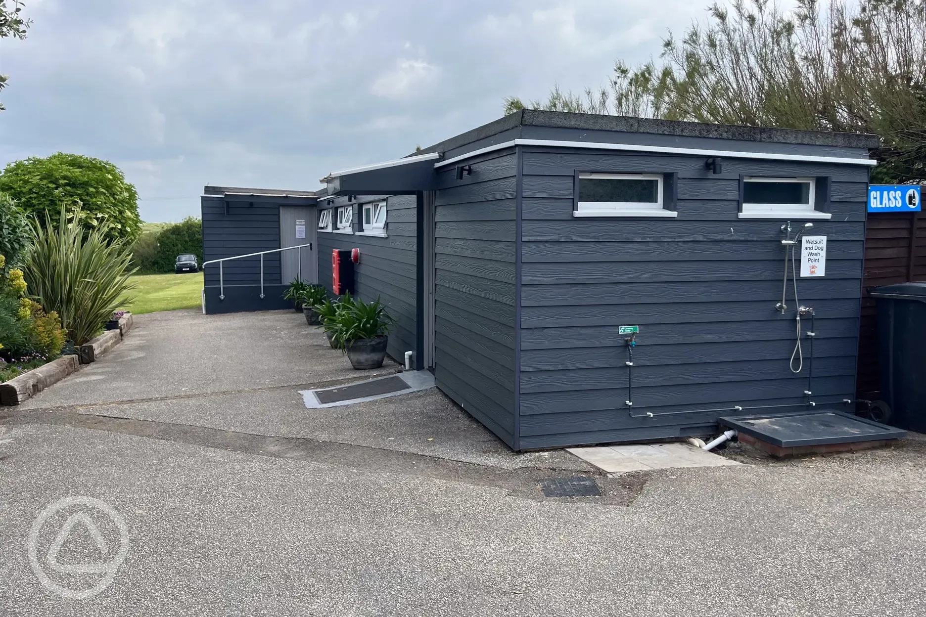 Facilities block with a wetsuit and dog wash point