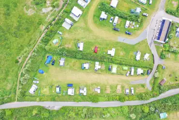 Birdseye view of the grass pitches at Tollgate Farm (awnings allowed)