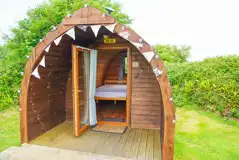 Log pod with a view of the 4ft double bed Log pod with a view of the 4ft double bed