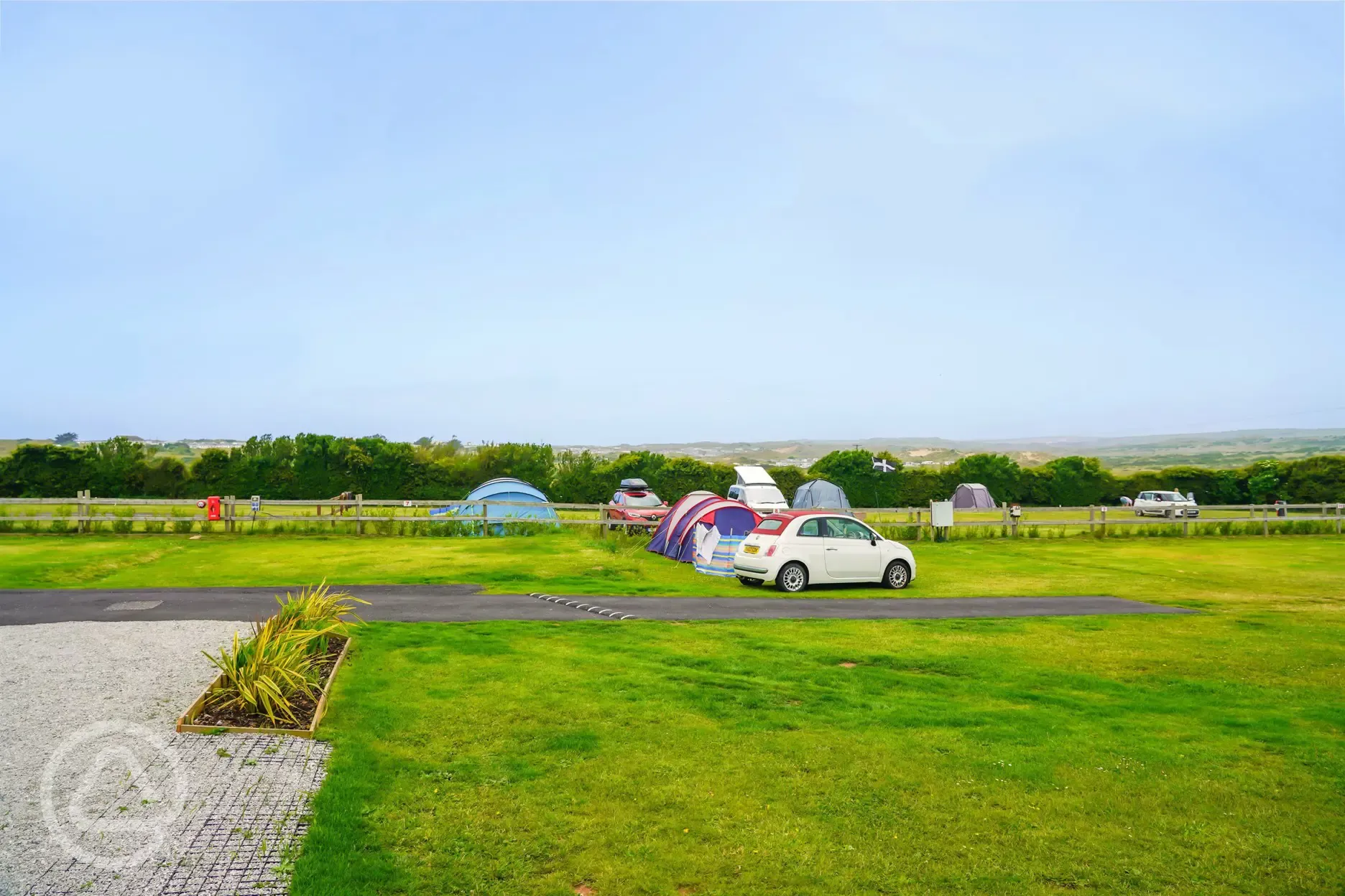 Non electric grass tent pitches with parking beside pitch permitted