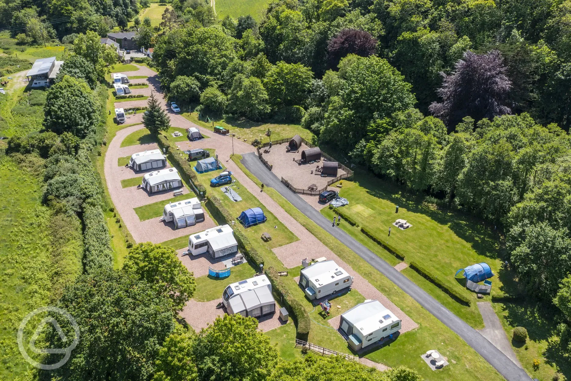View of the fully serviced pitches, pods, and grass pitches at Hele Valley 