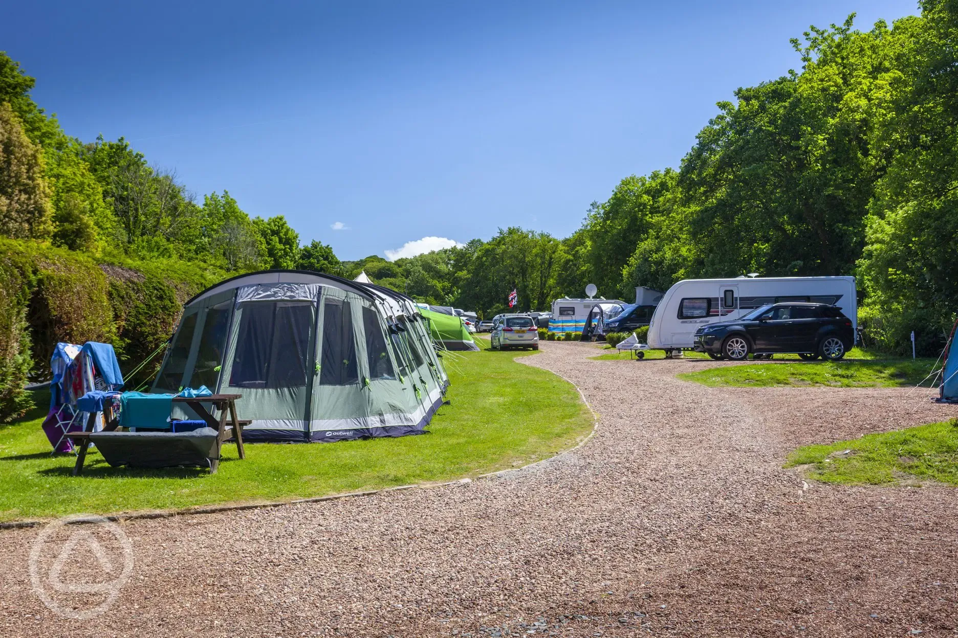 Tents and tourers on the grass and gravel pitches 