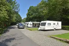 Gravel touring pitches with grass area alongside