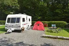 Gravel touring pitches with optional metered pre-paid 16 amp electric