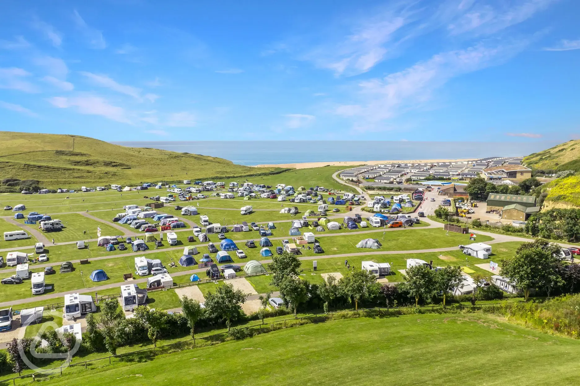 Aerial of Freshwater Beach camping field with views to the sea