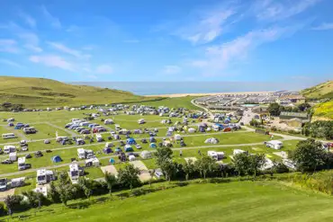 Aerial of Freshwater Beach camping field with views to the sea