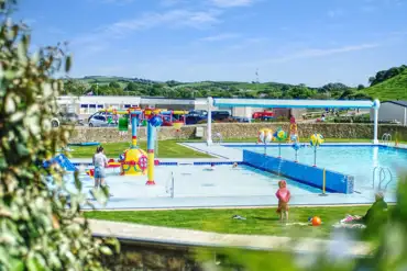 Outdoor swimming pool (open during summer) with a splash zone