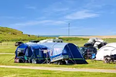 Electric grass pitches (Main Field) with sea views and 16 amp hook ups Electric grass pitches (Main Field) with sea views and 16 amp hook ups