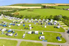 Aerial of the Main Field with electric grass and hardstanding pitches (16 amp) Aerial of the Main Field with electric grass and hardstanding pitches (16 amp)