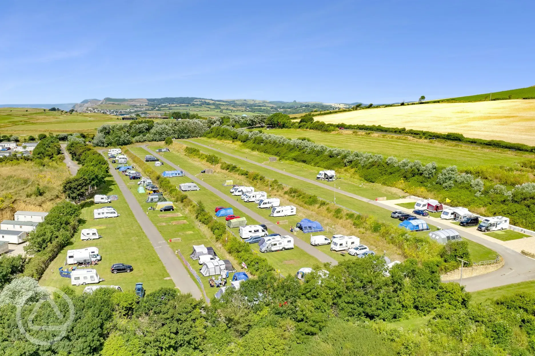 Aerial of the Top Field with electric grass and hardstanding pitches (16 amp)