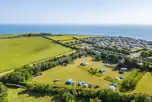 Aerial of the non electric grass pitches at Highlands End Holiday Park