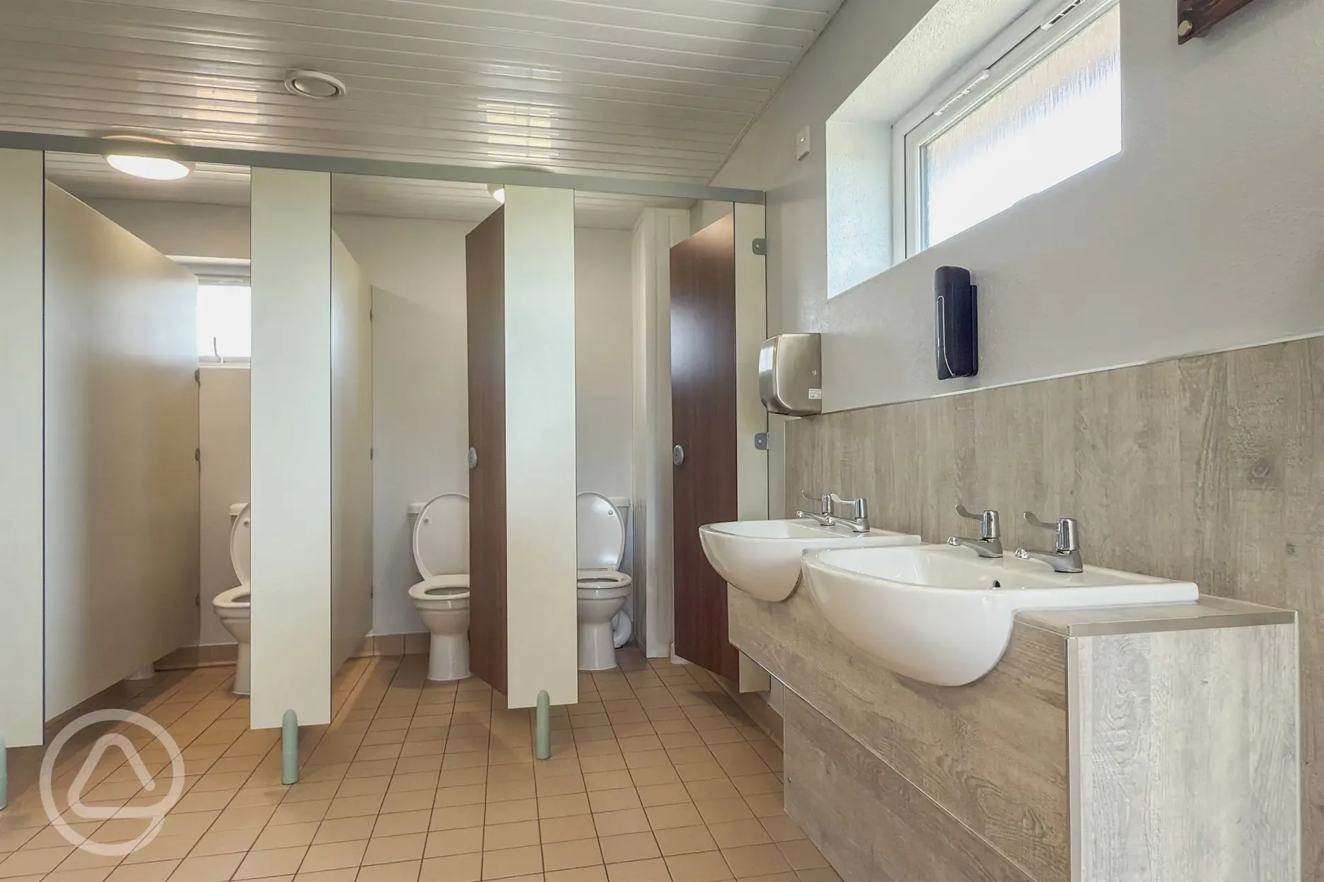 Toilet cubicles with sinks and hand dryers