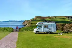 Electric grass pitches with sea views and 16 amp electric hook up Electric grass pitches with sea views and 16 amp electric hook up