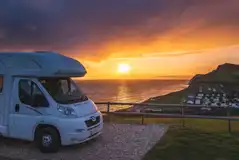 Electric gravel pitches at sunset, many with sea views 