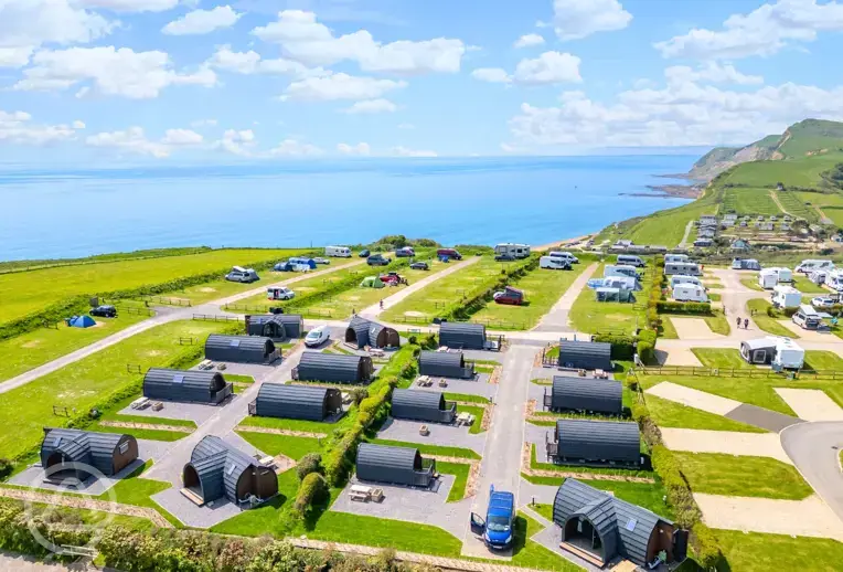 Aerial of the pods at Highlands End Holiday Park with views of the Dorset Coast