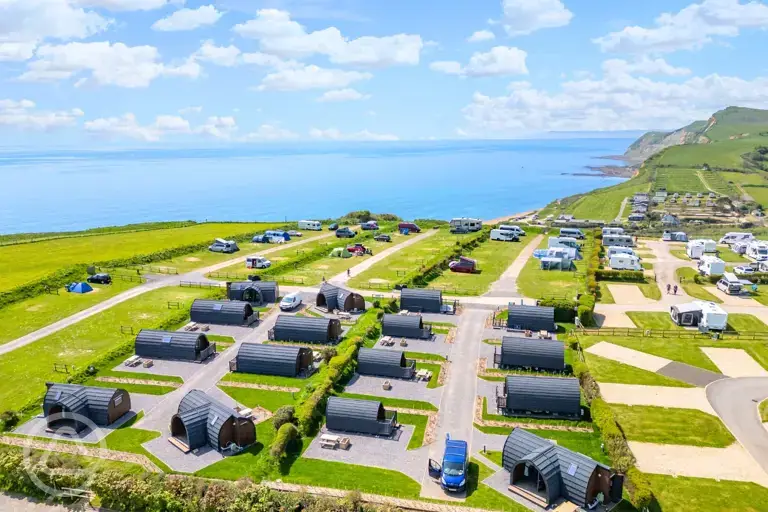 Aerial of the pods at Highlands End Holiday Park with views of the Dorset Coast