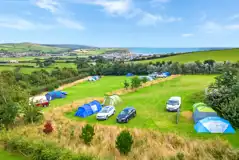 Non electric grass pitches for tents and VW campers up to 8m, measuring 8m by 8m Non electric grass pitches for tents and VW campers up to 8m, measuring 8m by 8m