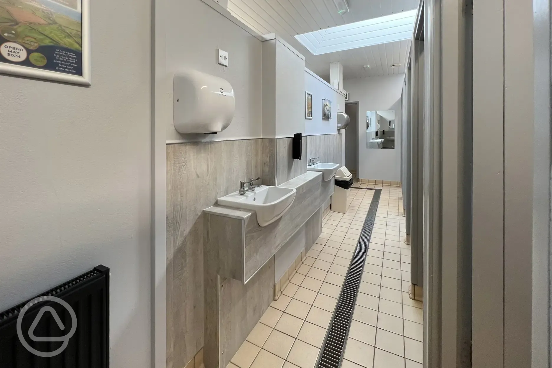 Toilets with sinks and mirrors