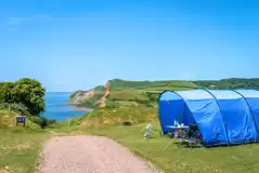 8m electric grass pitches with sea views and 16 amp electric hook up