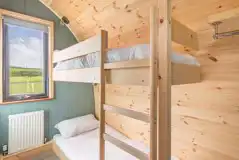 Large gold ensuite glamping pod bunk beds