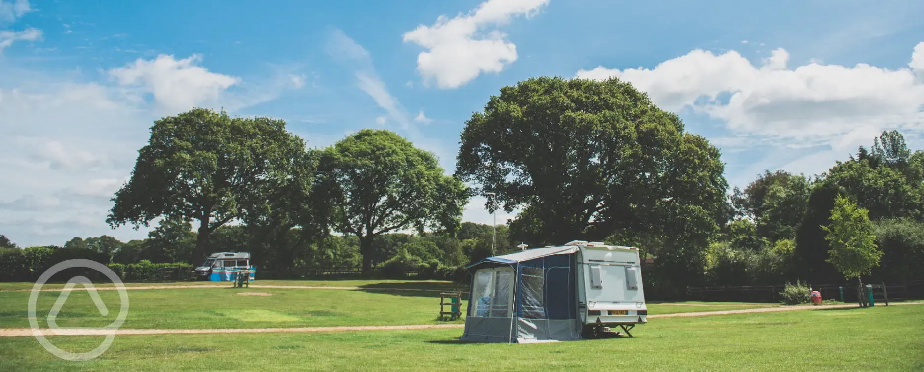 Green pitches at Red Shoot Camping Park