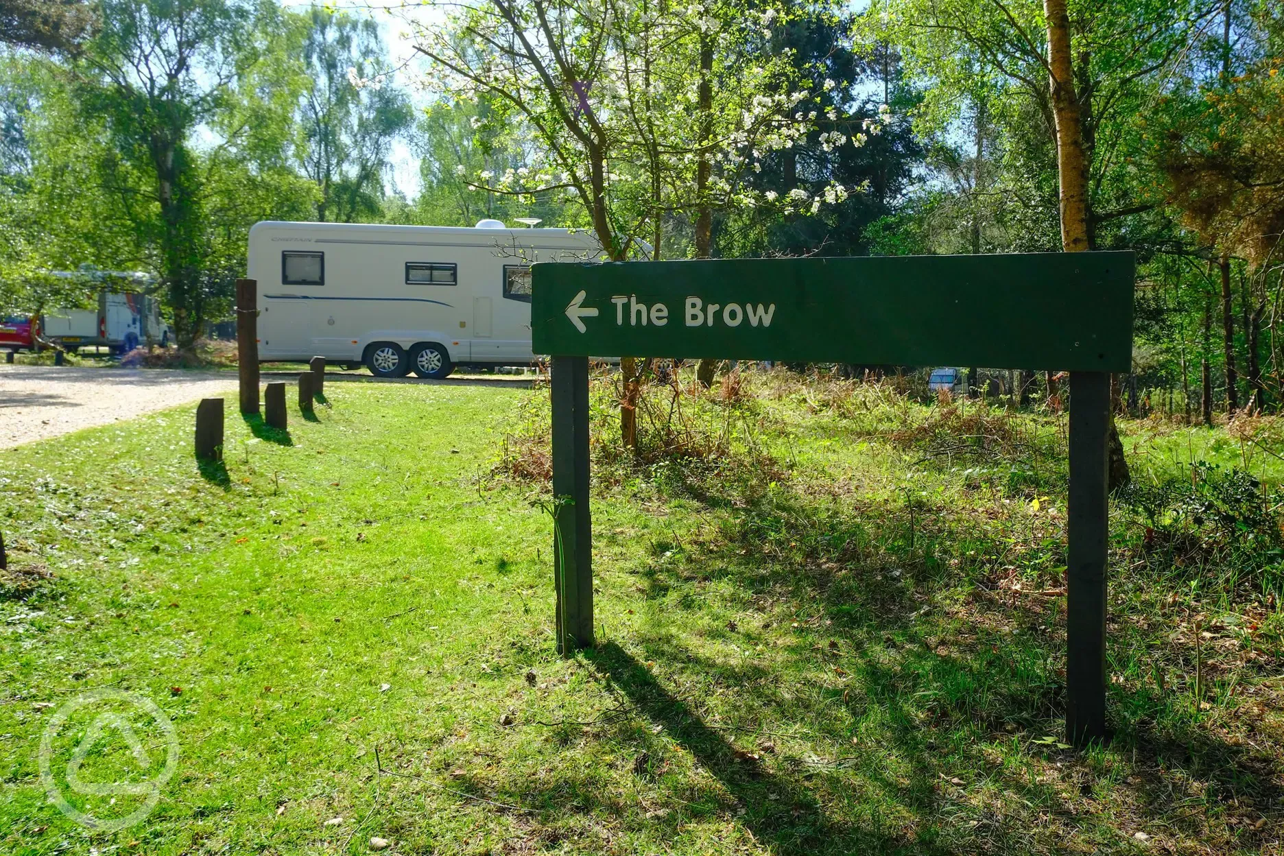 Signposts to pitch areas at Setthorns Campsite