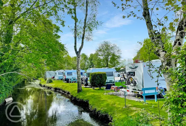 Electric hardstanding touring pitches by the River Yeo