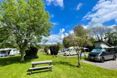 Electric hardstanding touring pitches with grassed areas between