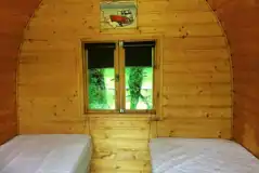 Camping pod interior with two single beds (bring own bedding and linen) Camping pod interior with two single beds (bring own bedding and linen)