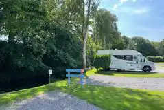 Electric hardstanding touring pitches by the River Yeo