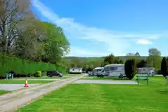 Electric hardstanding touring pitches with grassed areas between