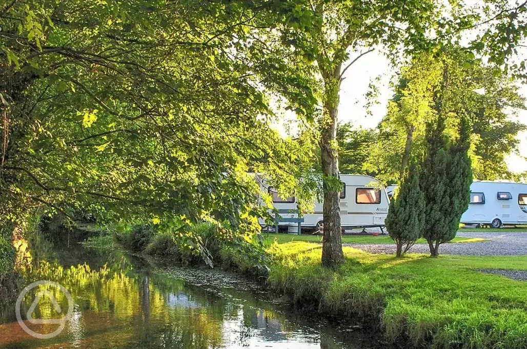 Electric hardstanding touring pitches by the River Yeo