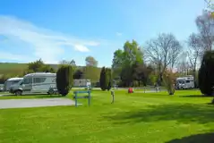 Electric hardstanding touring pitches with grassed areas between