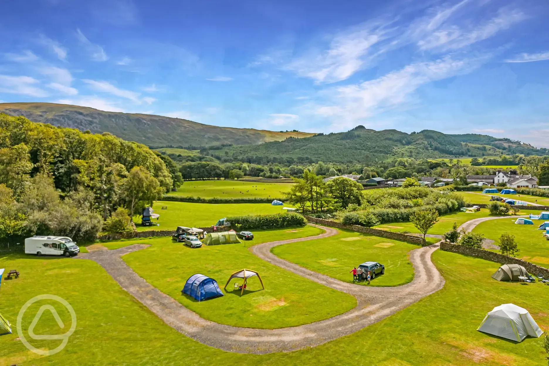 Aerial of grass pitches with a connecting road between fields