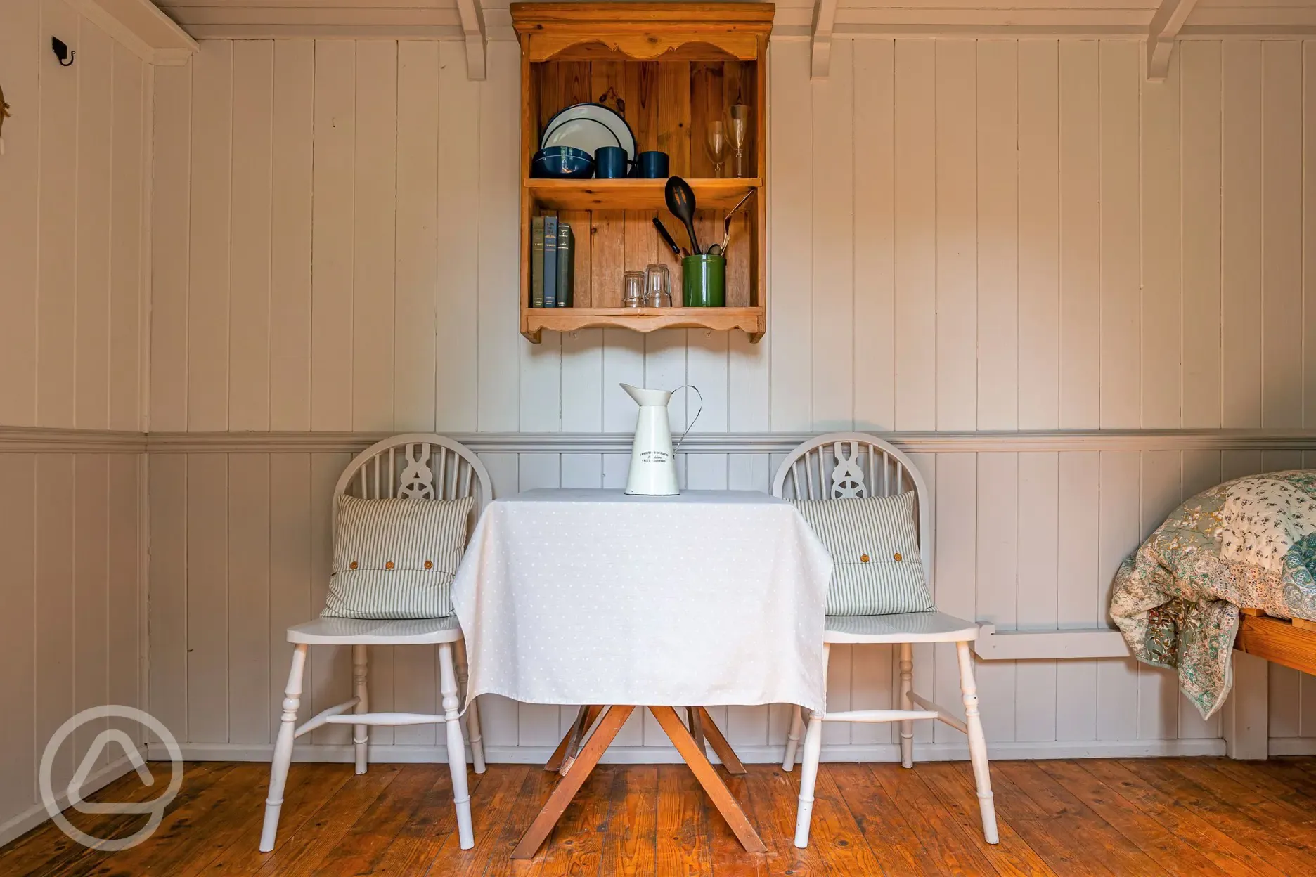 Shepherd's hut interior with a table and chairs