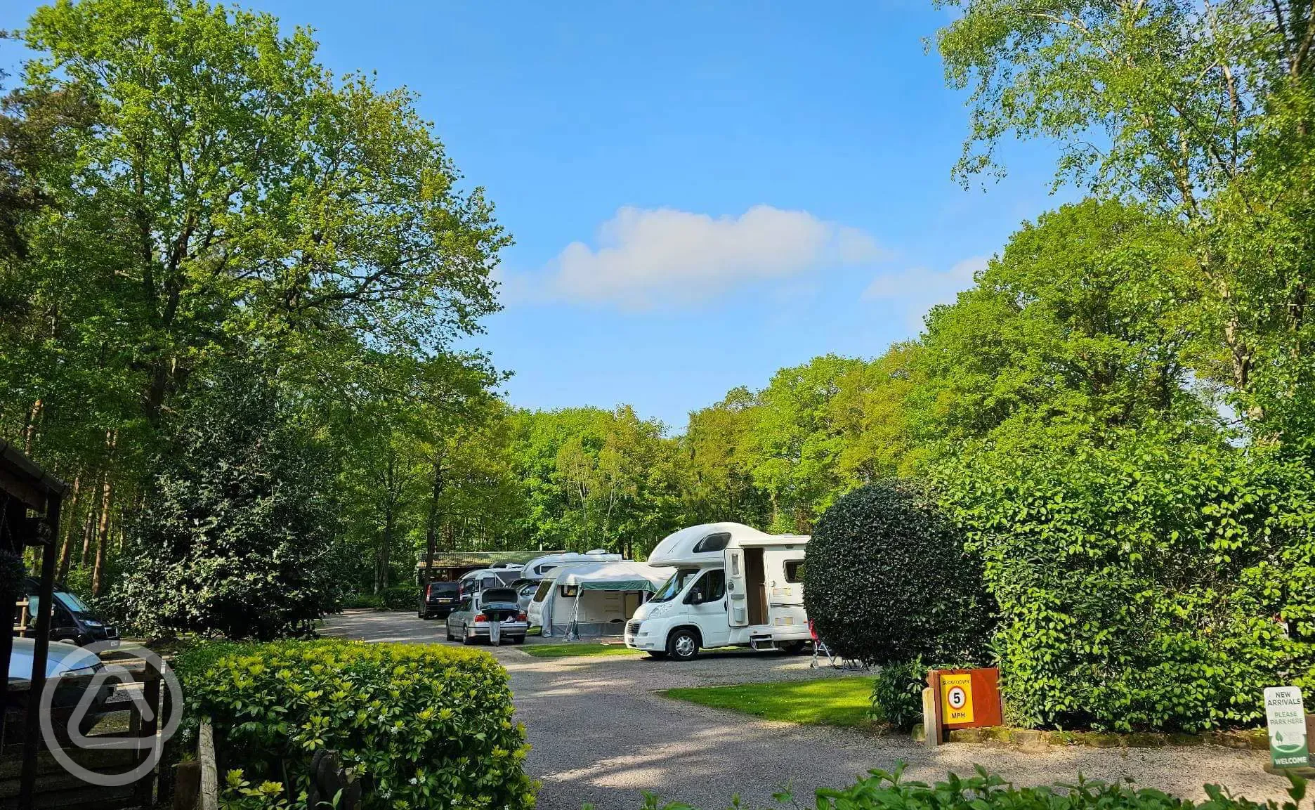 Electric hardstanding and grass pitches for tourers at Somers Wood