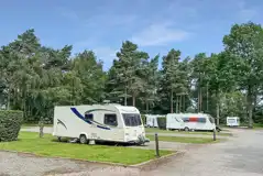 Electric hardstanding and grass pitches