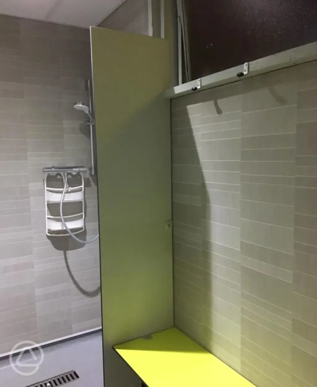 Hot private showers next to a changing bench