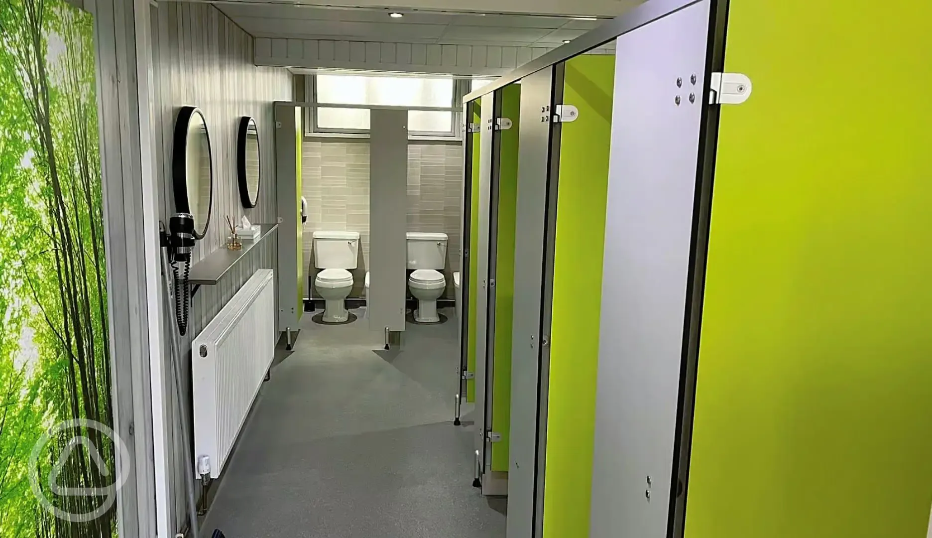 Toilet block offering mirrors and hair dryers