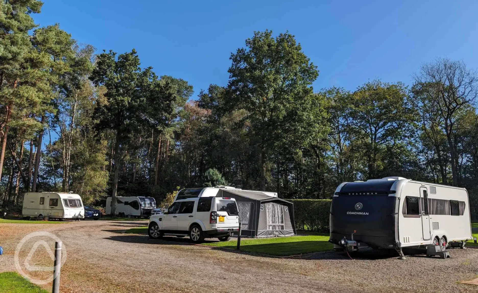 Electric hardstanding and grass pitches (awnings allowed)
