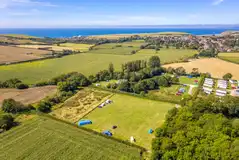 Aerial of Graston Copse Holiday Park with views to the coast Aerial of Graston Copse Holiday Park with views to the coast