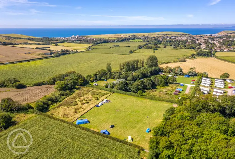 Aerial of Graston Copse Holiday Park with views to the coast