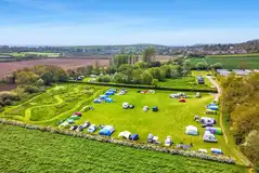 Aerial of the non electric grass pitches in the Lower Meadow and dog walk area Aerial of the non electric grass pitches in the Lower Meadow and dog walk area