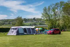 Tents on the lower meadow non electric camping pitches, measuring 10m x 10m Tents on the lower meadow non electric camping pitches, measuring 10m x 10m
