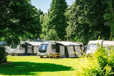 Grass pitches with electric and water at Lickhill Manor Caravan Park 