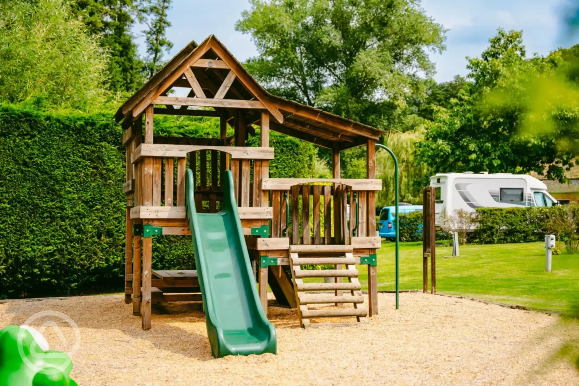 Play park (for the family friendly holiday homes) by the touring pitches
